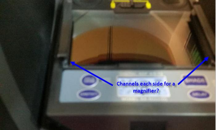 Groove/channel each side for a magnifier?